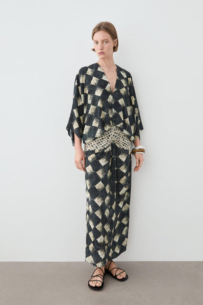 Flowing dress with sash belt detail