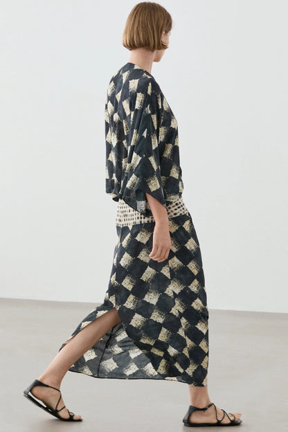 Flowing dress with sash belt detail